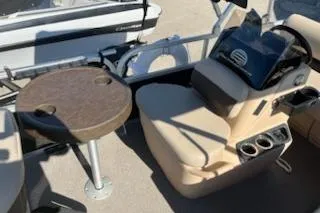 Slide: The Image of 2019 Sun Tracker Bass Buggy 16 DLX ET interior with seating and table. - 5