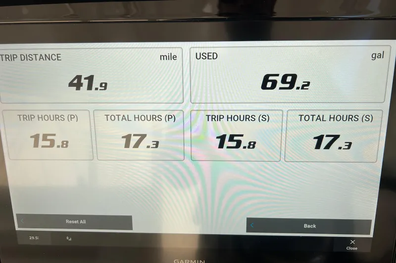 Slide: The Image of Display screen showing trip data for Pursuit OS 355 Offshore 2026, including distance and fuel usage. - 17