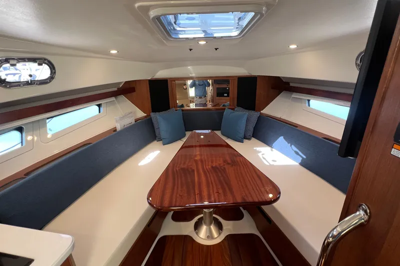 Slide: The Image of Luxurious interior of 2026 Pursuit OS 355 Offshore boat with elegant seating and wooden table. - 20