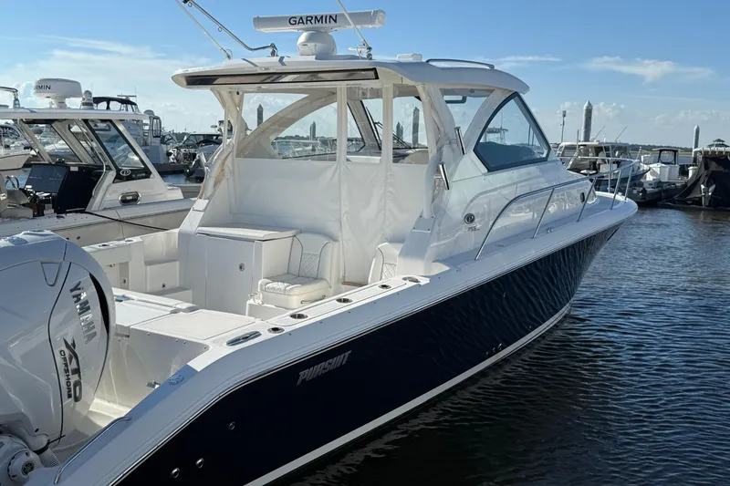 Slide: The Image of 2026 Pursuit OS 355 Offshore boat docked, featuring sleek design and Yamaha engine. - 9
