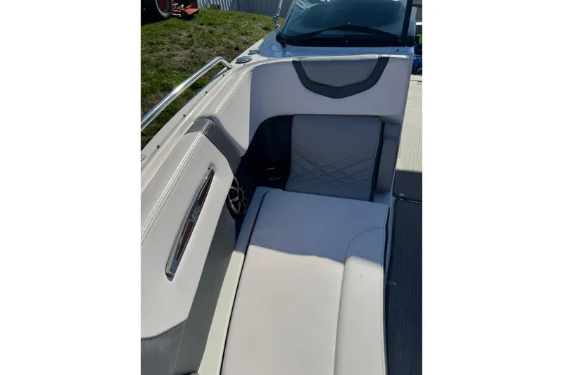 Slide: The Image of 2019 Chaparral 297 SSX boat interior with cushioned seating and sleek design. - 14