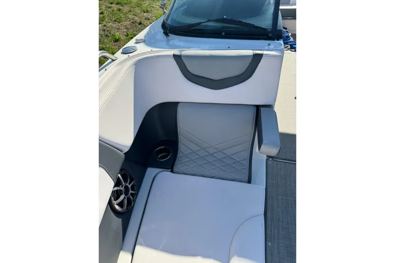 Slide: The Image of 2019 Chaparral 297 SSX boat interior with gray seating and speaker detail. - 15