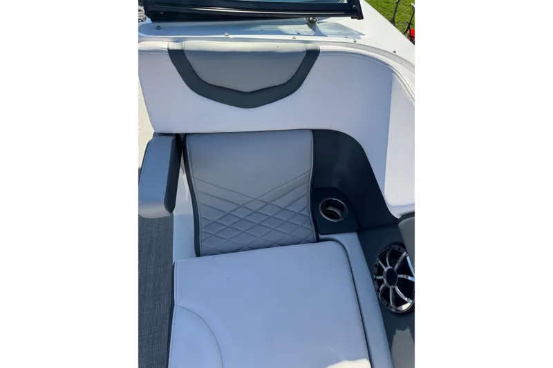 Slide: The Image of 2019 Chaparral 297 SSX boat interior with gray seating and cup holder. - 16