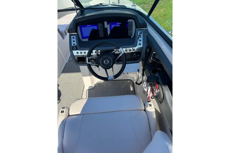 Slide: The Image of 2019 Chaparral 297 SSX boat cockpit with modern steering and control panel. - 17