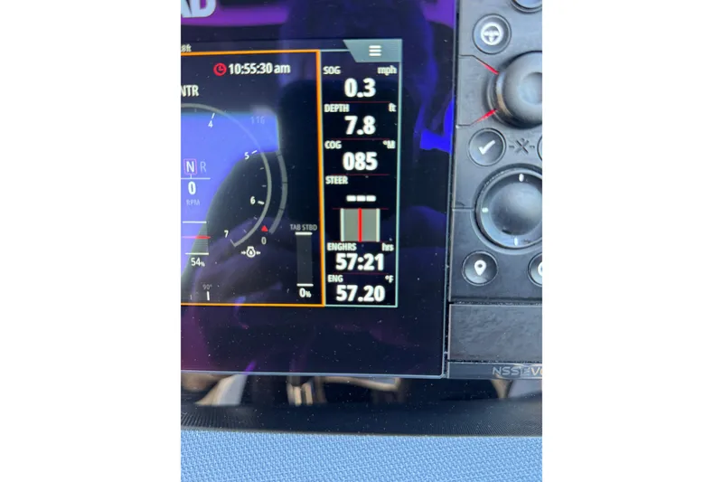 Slide: The Image of Dashboard display of a 2019 Chaparral 297 SSX boat showing engine hours and speed. - 26