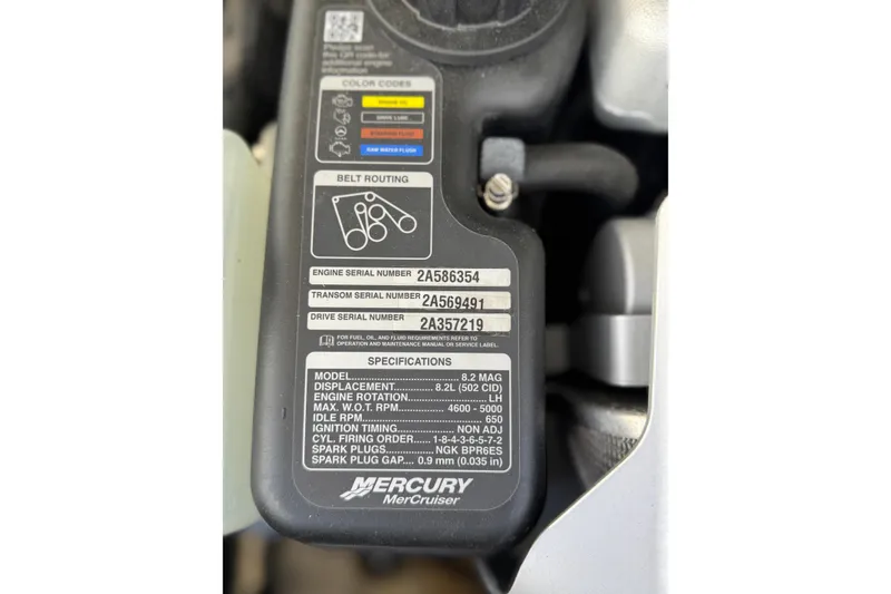 Slide: The Image of Engine specifications label on a 2019 Chaparral 297 SSX boat, featuring serial numbers and belt routing. - 30