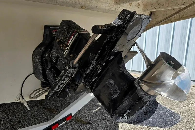 Slide: The Image of 1997 Sea Ray 240 Sundancer boat propeller and outdrive close-up. - 18