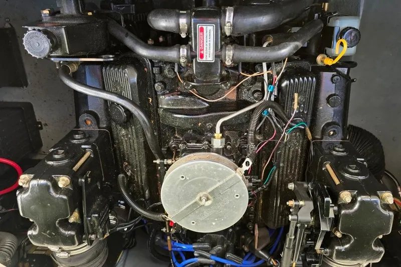 Slide: The Image of Engine of a 1997 Sea Ray 240 Sundancer boat, showing detailed components and wiring. - 20