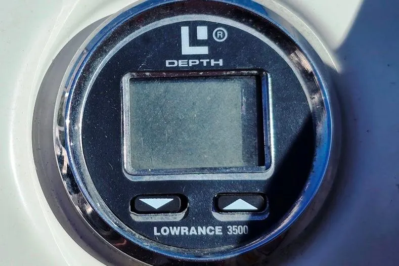 Slide: The Image of Lowrance 3500 depth gauge on 1997 Sea Ray 240 Sundancer boat dashboard. - 24