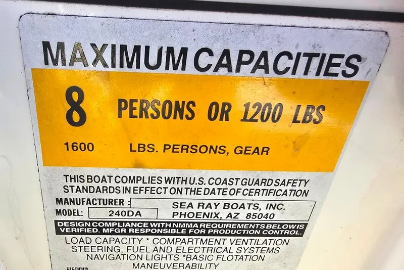 Slide: The Image of 1997 Sea Ray 240 Sundancer capacity label: 8 persons or 1200 lbs, U.S. Coast Guard compliant. - 26