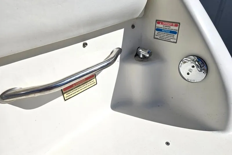 Slide: The Image of 1997 Sea Ray 240 Sundancer boat fuel cap and safety warning labels. - 29