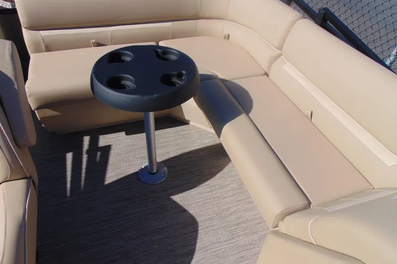 Slide: The Image of Luxurious seating area on 2026 Godfrey EX 1880 Cruise boat with cup holder table. - 10
