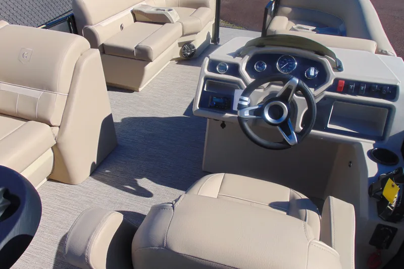Slide: The Image of 2026 Godfrey EX 1880 Cruise boat interior with beige seating and modern dashboard. - 11