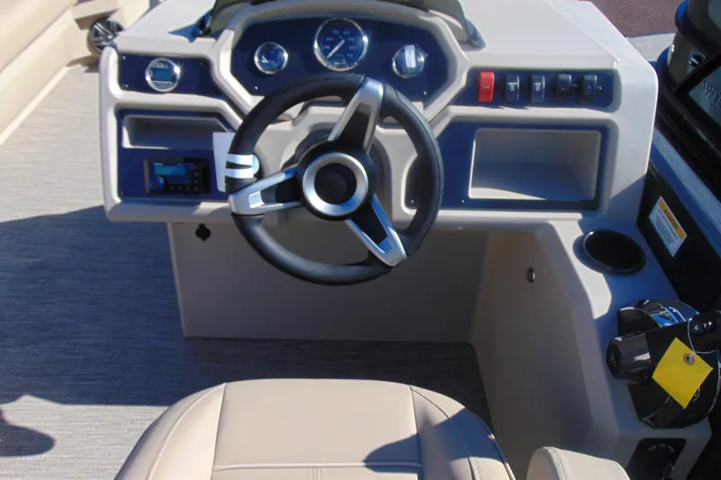 Slide: The Image of 2026 Godfrey EX 1880 Cruise boat dashboard with steering wheel and control panel. - 12