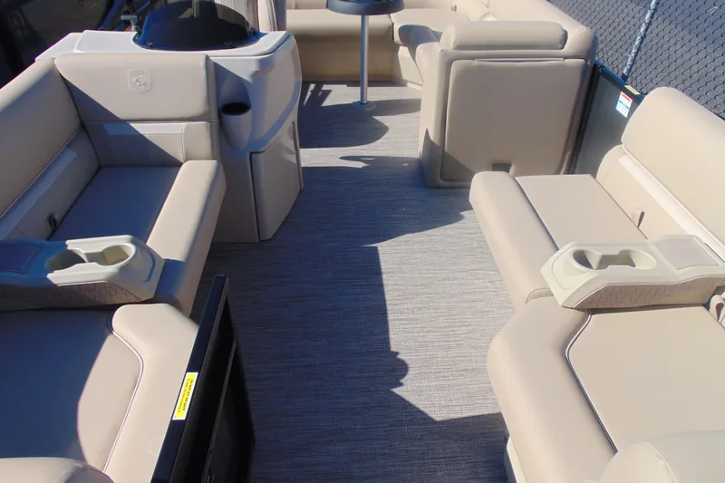 Slide: The Image of Interior of 2026 Godfrey EX 1880 Cruise boat with beige seating and cup holders. - 3