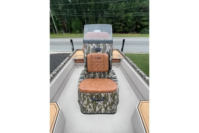 Slide: The Image of 2026 Avid 21 FSX boat interior with camo design and brown seating. - 2