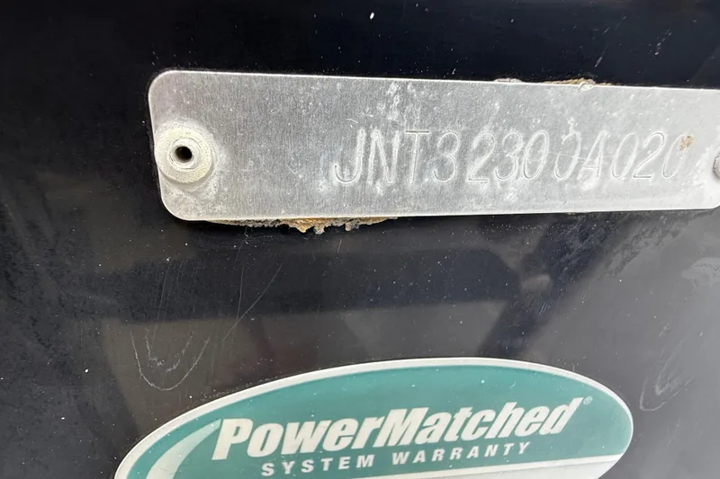 Slide: The Image of 2020 NauticStar 2602 Legacy boat with PowerMatched System Warranty label. - 10