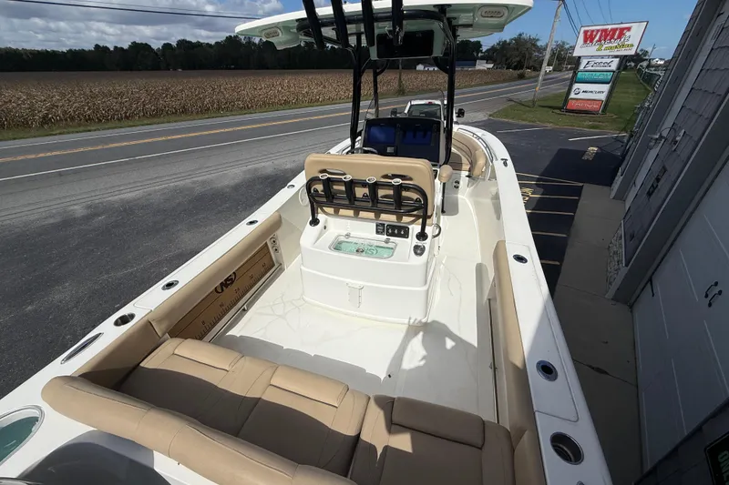 Slide: The Image of 2020 NauticStar 2602 Legacy boat interior with seating and control panel. - 13