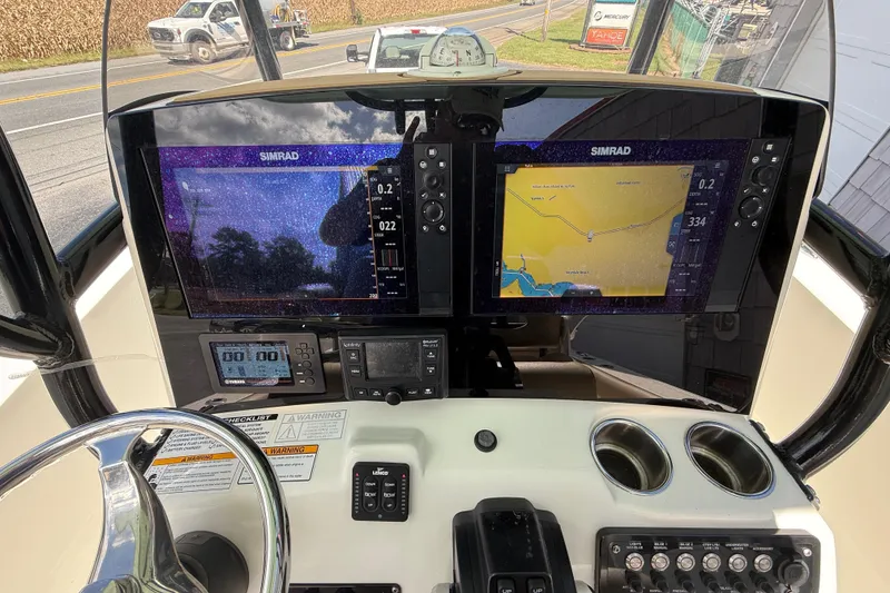 Slide: The Image of Control panel of 2020 NauticStar 2602 Legacy boat with dual Simrad displays. - 31