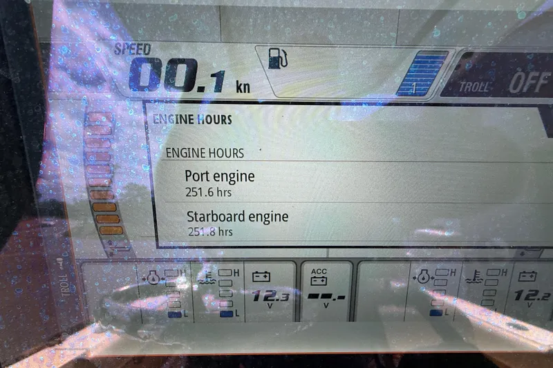 Slide: The Image of Display screen of 2020 NauticStar 2602 Legacy showing engine hours and speed. - 32