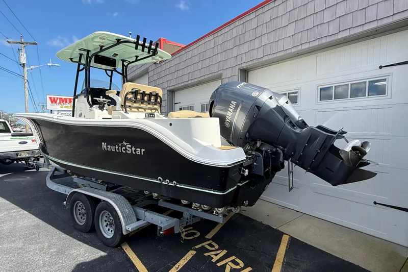 Slide: The Image of 2020 NauticStar 2602 Legacy boat on trailer, featuring Yamaha outboard motor. - 5