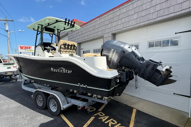 Slide: The Image of 2020 NauticStar 2602 Legacy boat on trailer, featuring Yamaha outboard motor. - 6