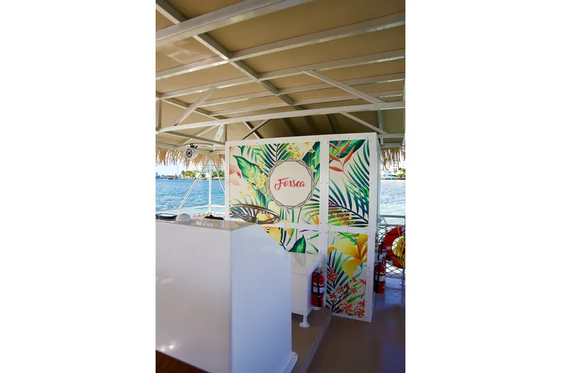 Slide: The Image of Tropical-themed boat interior with vibrant floral decor, A&M Manufacturing Bulldog 43, 2027 model. - 10