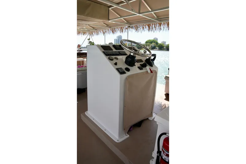 Slide: The Image of Control panel of A&M Manufacturing Bulldog 43 boat, 2027 model, with steering wheel and gauges. - 14