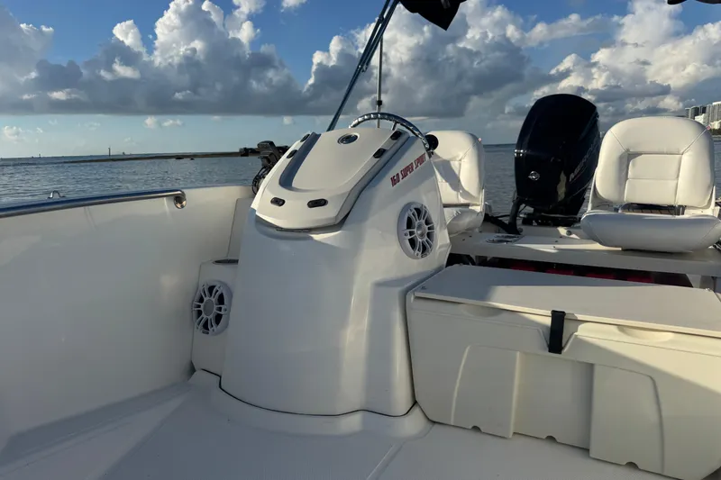 Slide: The Image of 2021 Boston Whaler 160 Super Sport boat interior with seating and steering console. - 14