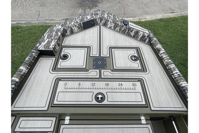 Slide: The Image of 2026 Avid 18 Commander boat deck with camo trim and measurement markings. - 2