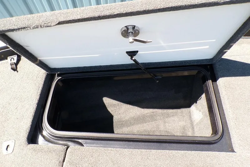 Slide: The Image of Open storage compartment in 2016 Ranger Z520 Comanche boat. - 13