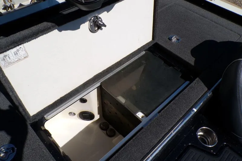 Slide: The Image of 2016 Ranger Z520 Comanche boat storage compartment with open lid and interior view. - 21