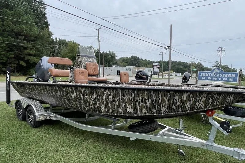 The Image of 2026 Avid 21 Fusion boat with camouflage design on a trailer at Southeastern Marine. - 0