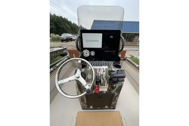 Slide: The Image of Avid 21 Fusion 2026 boat console with Garmin navigation system and steering wheel. - 3