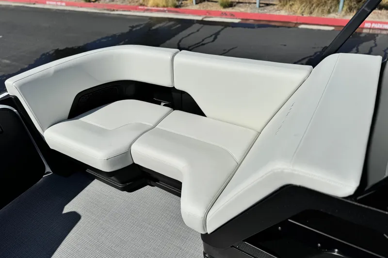 Slide: The Image of 2026 Manitou Cruise 22 Max boat seating with sleek white upholstery. - 11