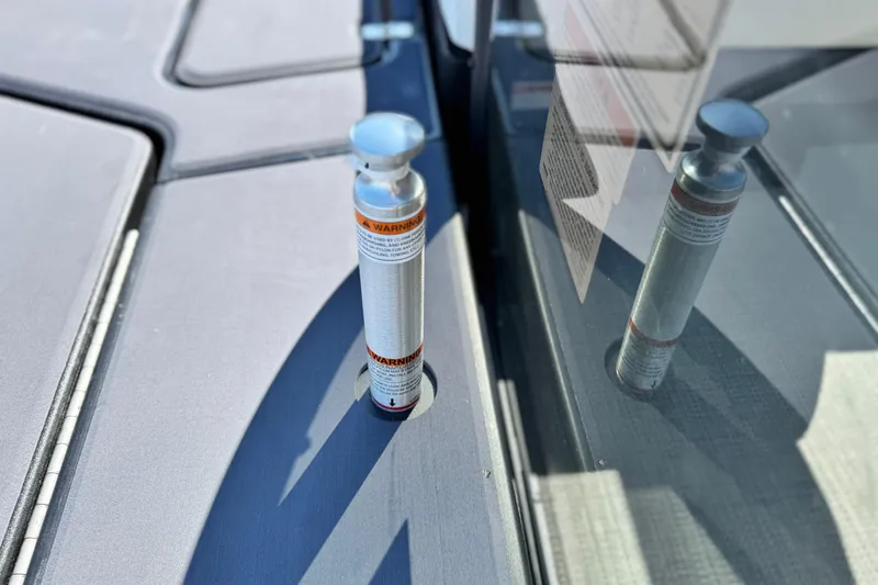 Slide: The Image of Safety pin on 2026 Manitou Cruise 22 Max boat deck. - 19