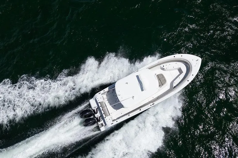 Slide: The Image of 2023 Sportsman Open 322 Center Console boat cruising on open water. - 22