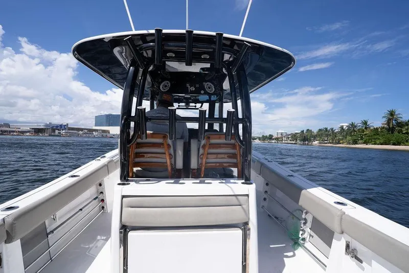 Slide: The Image of 2023 Sportsman Open 322 Center Console boat cruising on a sunny day. - 39