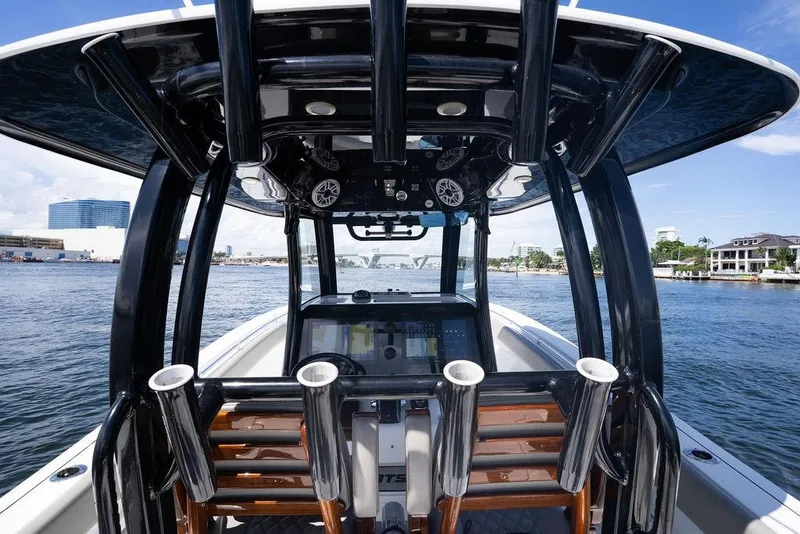 Slide: The Image of 2023 Sportsman Open 322 Center Console boat on water, featuring advanced navigation equipment. - 42