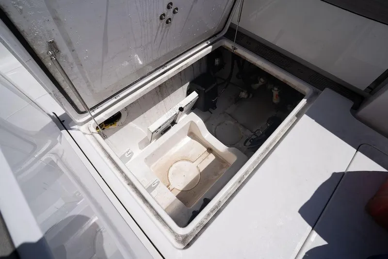 Slide: The Image of Open storage compartment on 2023 Sportsman Open 322 Center Console boat. - 46
