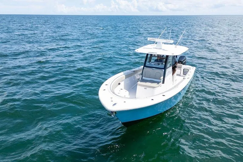 Slide: The Image of 2023 Sportsman Open 322 Center Console boat on open ocean waters. - 5