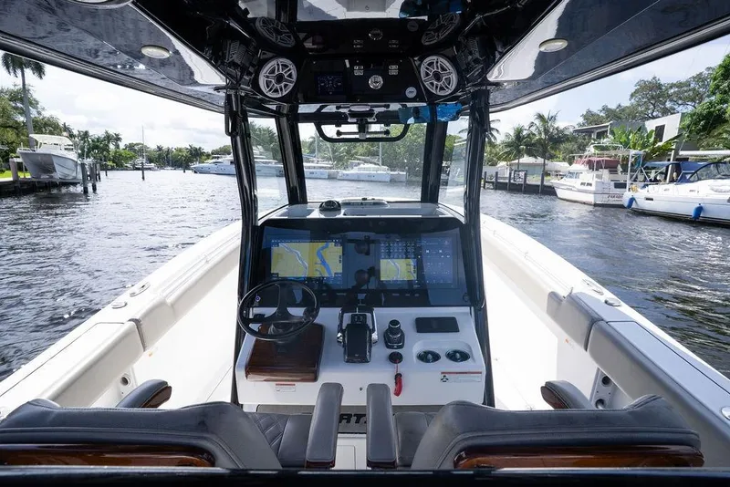 Slide: The Image of 2023 Sportsman Open 322 Center Console boat interior with advanced navigation system. - 53
