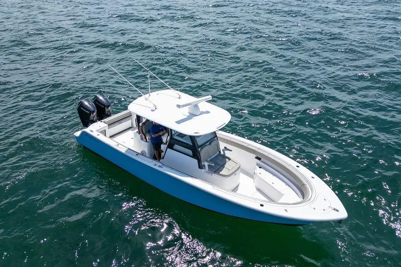 Slide: The Image of 2023 Sportsman Open 322 Center Console boat on open water, aerial view. - 7