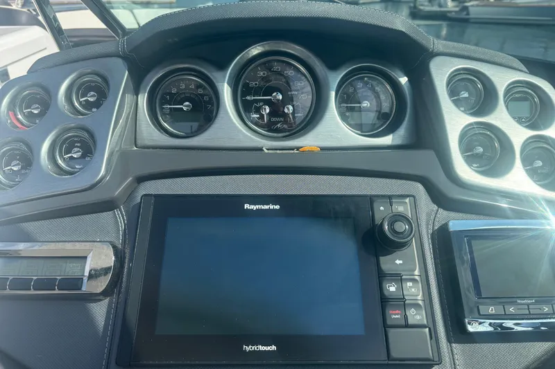 Slide: The Image of Control panel of a 2018 Monterey 328SS Super Sport boat with gauges and throttle. - 6