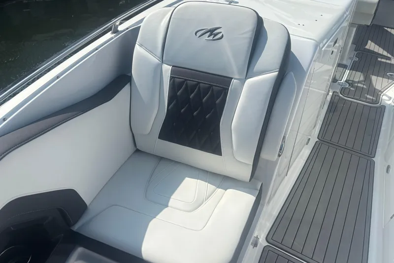 Slide: The Image of Control panel of a 2018 Monterey 328SS Super Sport boat with throttle and joystick. - 7