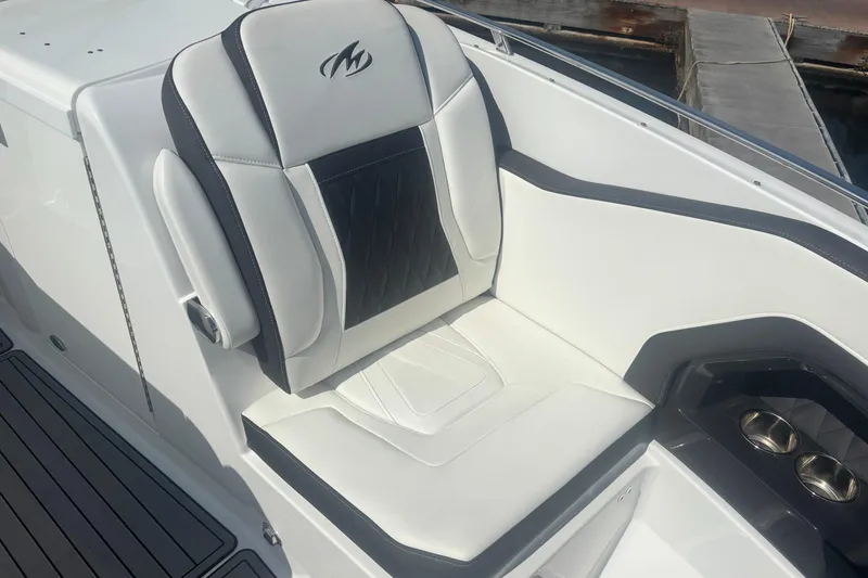 Slide: The Image of 2018 Monterey 328SS Super Sport boat interior with cushioned seating and logo. - 9