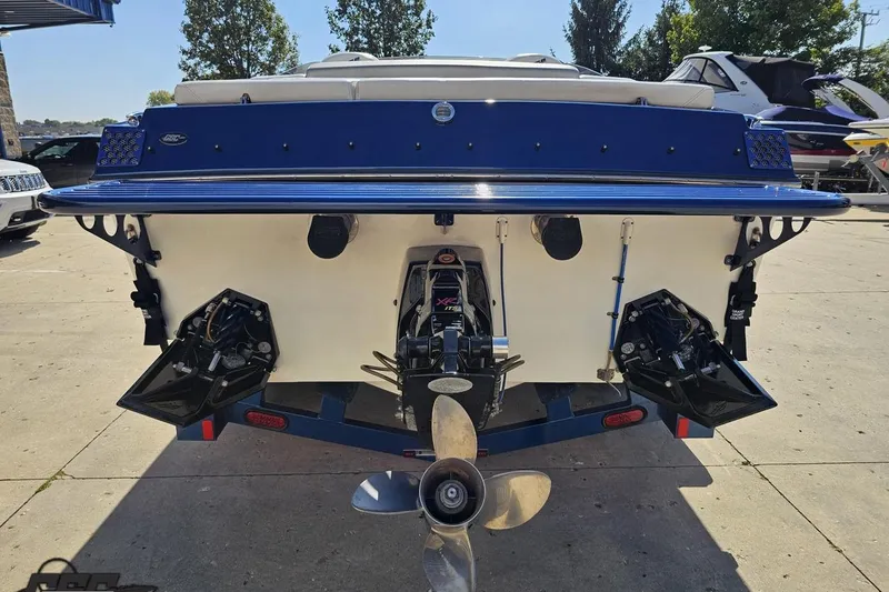 Slide: The Image of Rear view of a 2010 Hustler 266 Classic boat with dual propellers. - 28