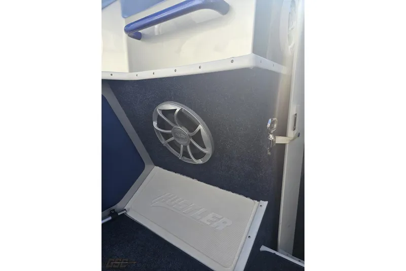 Slide: The Image of Interior of 2010 Hustler 266 Classic boat with speaker and branded mat. - 50