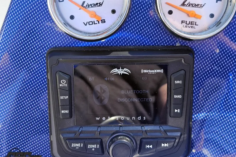 Slide: The Image of Dashboard of 2010 Hustler 266 Classic with Livorsi gauges and Bluetooth stereo system. - 58