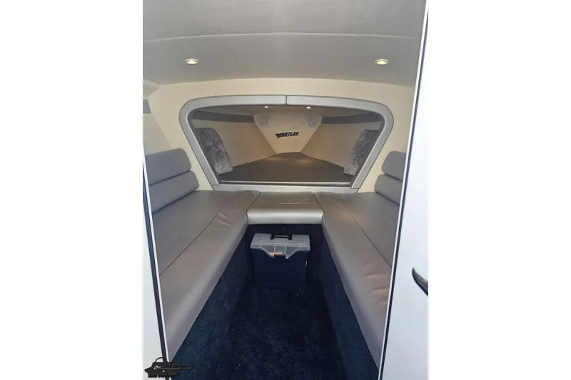 Slide: The Image of Interior of 2010 Hustler 266 Classic boat with cushioned seating and modern design. - 67